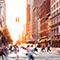 A busy city street corner with many pedestrians crossing the street as cars speed past and upscale storefronts lit by golden early morning light