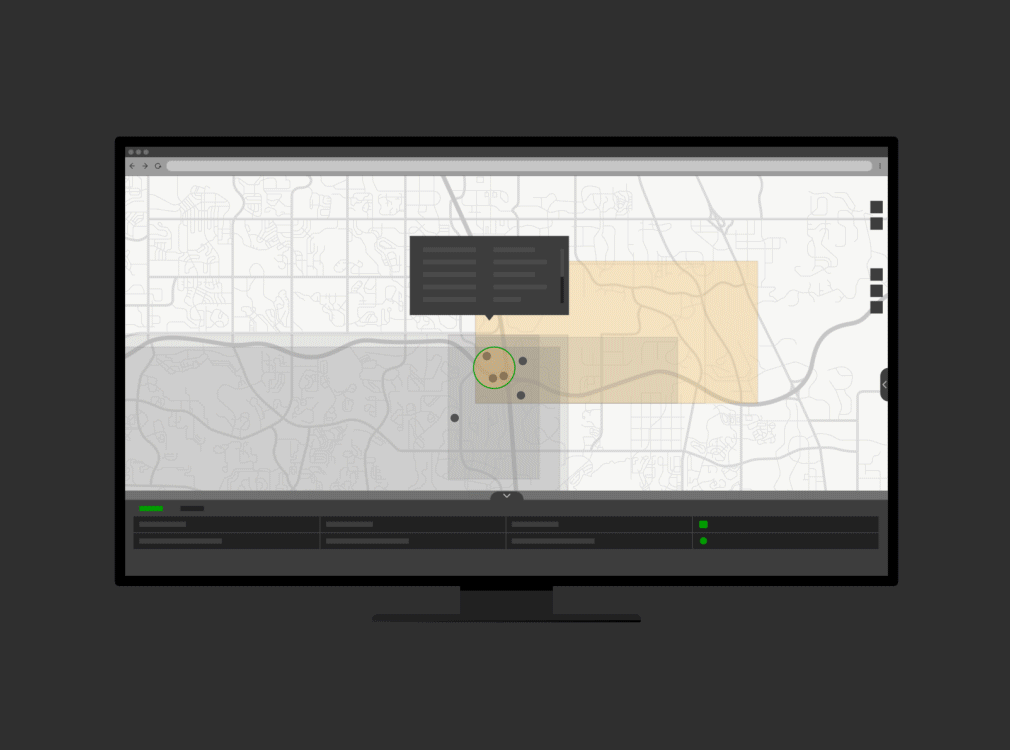 Computer monitor showing a white and gray digital street map and scattered data points