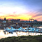 A view of the Walk Bridge in Norwalk, Connecticut with boats docked in the foreground and the city in the background