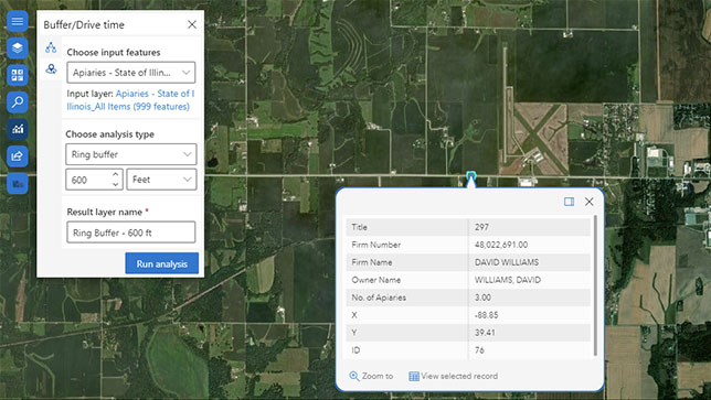 Satellite image with green land and two white popup boxes with text representing a buffer drive layer and feature selection