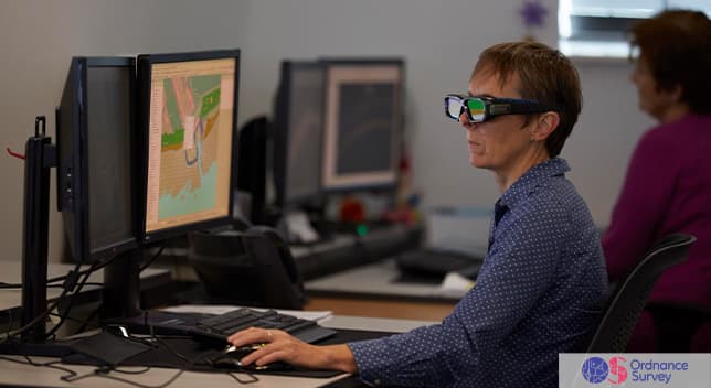 Image of a person using a desktop computer with specialized glasses on