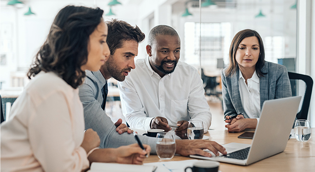 Diverse group of people working together in a conference room