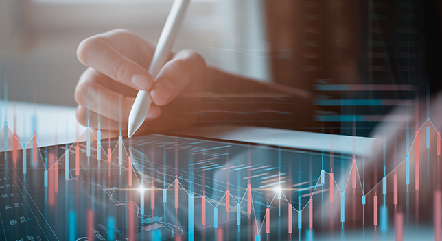 A person writing with a white stylus on a tablet while 3D graphs rise from the tablet showing market analysis and demographics