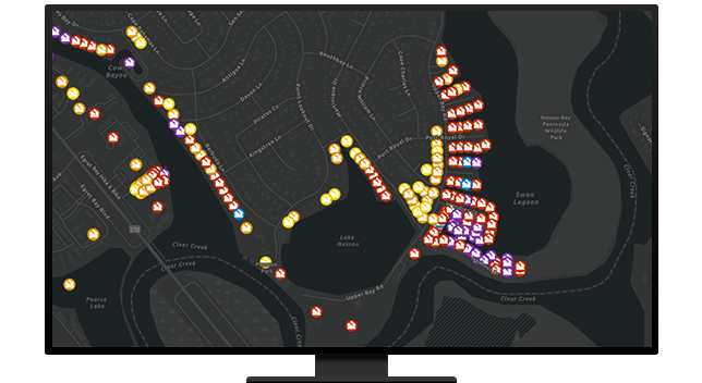 A desktop computer showing a map with bright activate resource locations indicated on a dark background