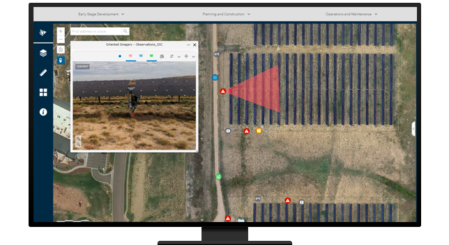 A desktop computer displaying a close-up of one part of a solar farm