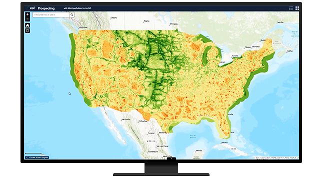 A green and yellow map of the United States, a person in business attire working on a tablet