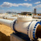 Many different above-ground pipelines on the construction site for a utility facility